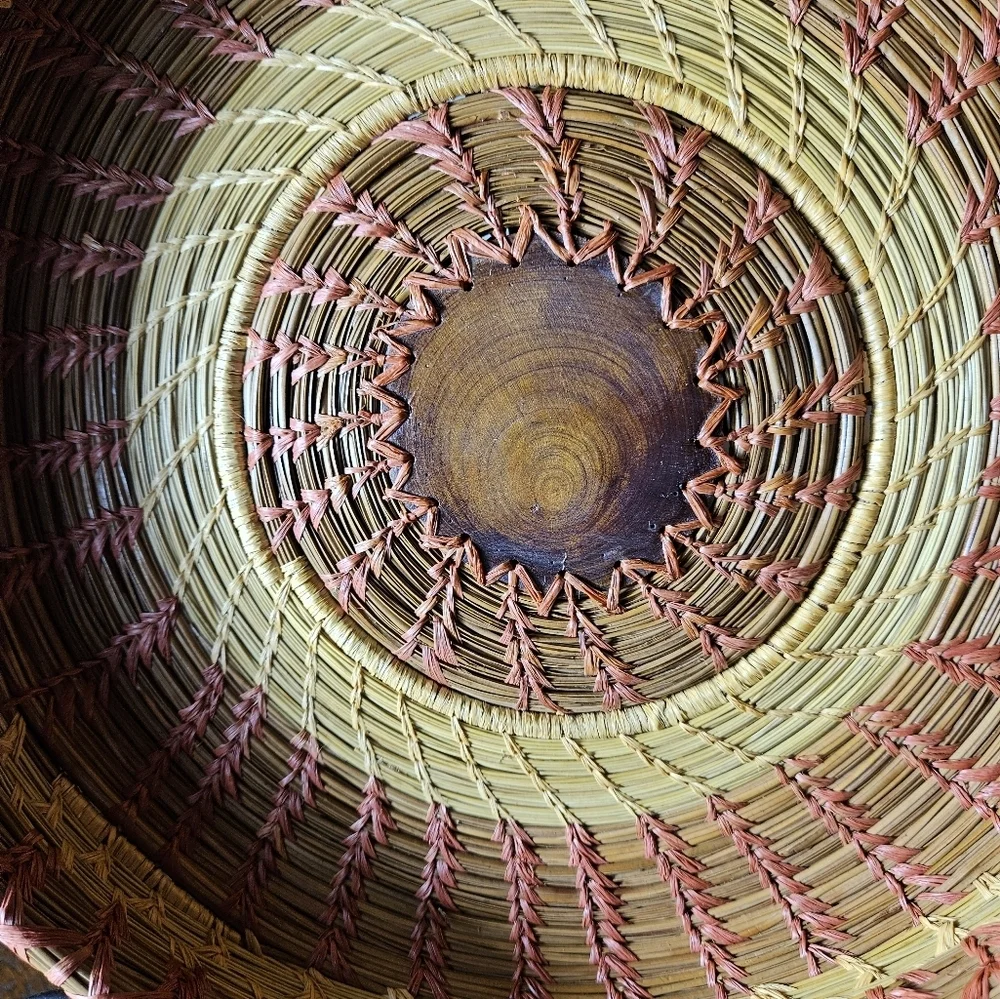 Primitive Handwoven 10 Inche Basket With A Wood Medallian In The Middle.